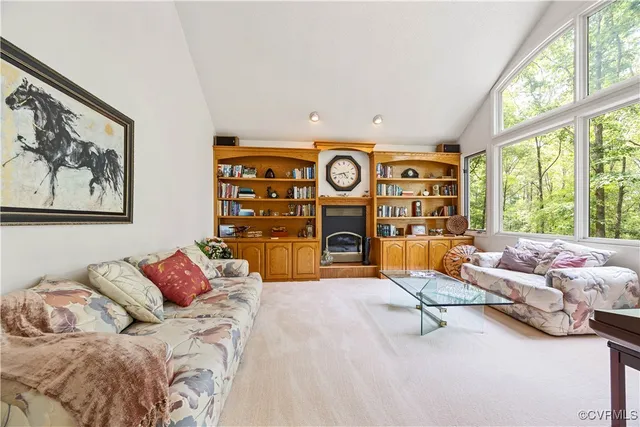 a view of a bedroom with furniture and wooden floor