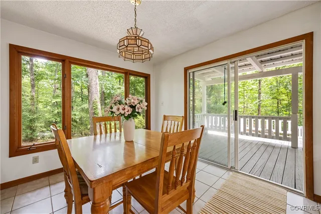 a large kitchen with a table and chairs