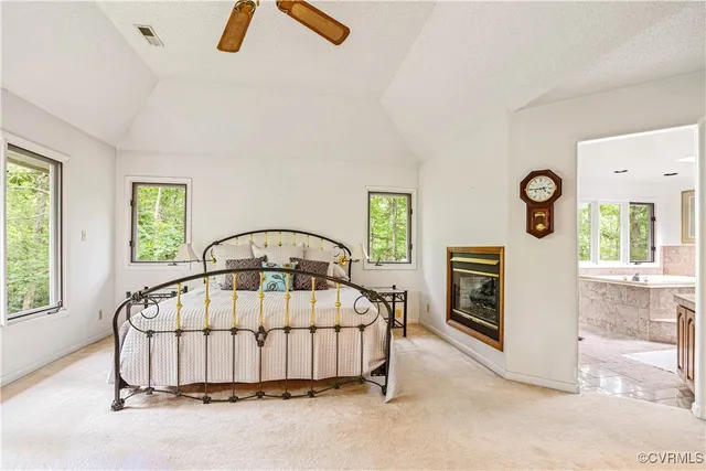 a bedroom with a bed and a balcony view