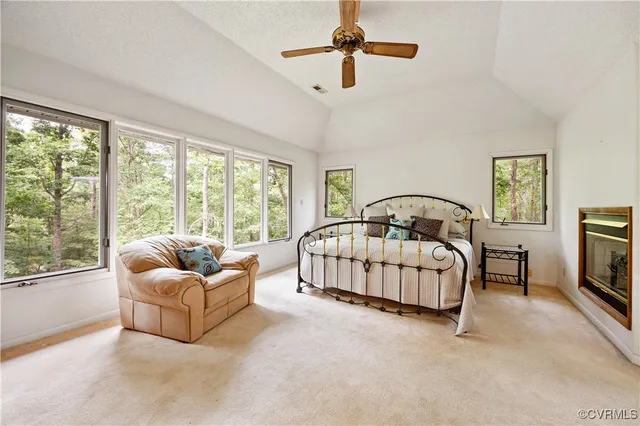 a bathroom with a granite countertop tub sink and mirror