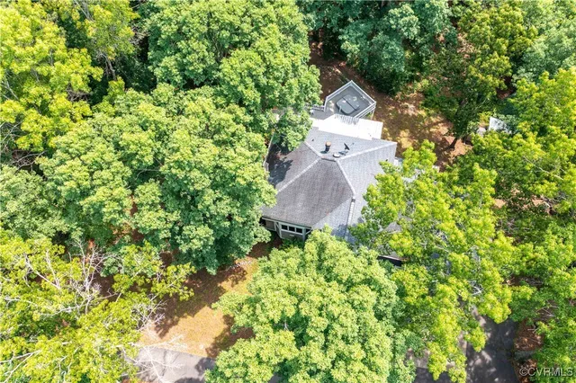 a view of a wooden deck with a yard