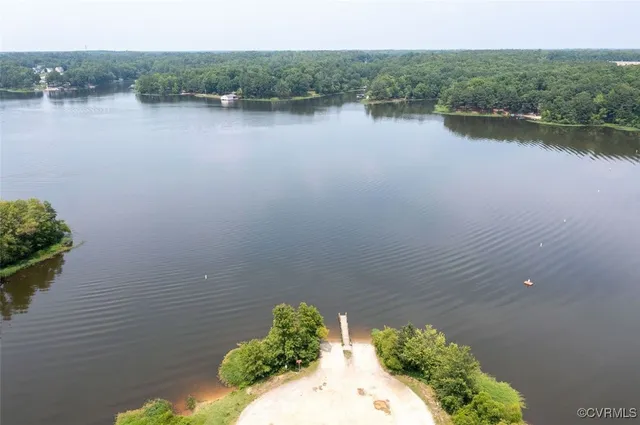 a view of a lake with a house in the background