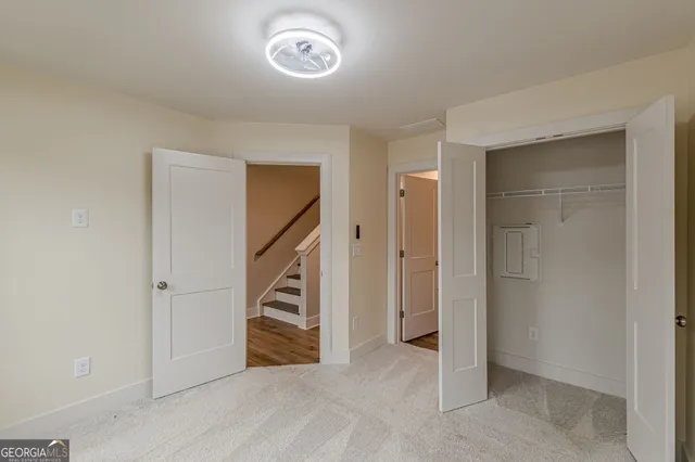 a bathroom with a bathtub shower sink vanity mirror and toilet