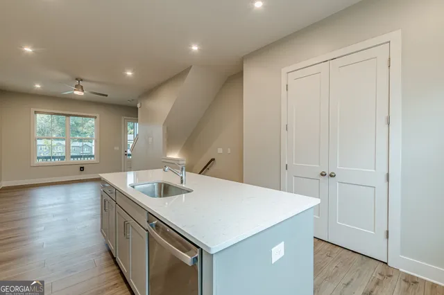 a kitchen with a sink stove and microwave