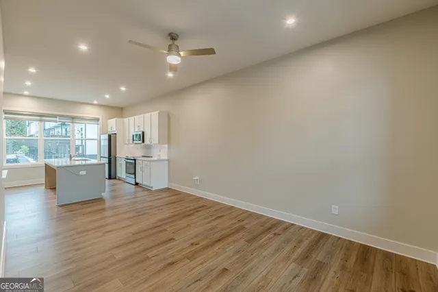 wooden floor in an empty room with stairs