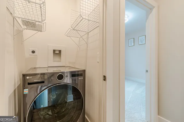 a bathroom with a toilet sink and shower