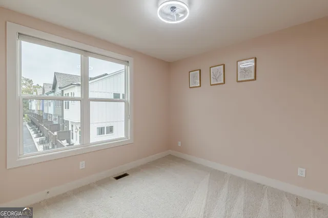 an empty room with windows