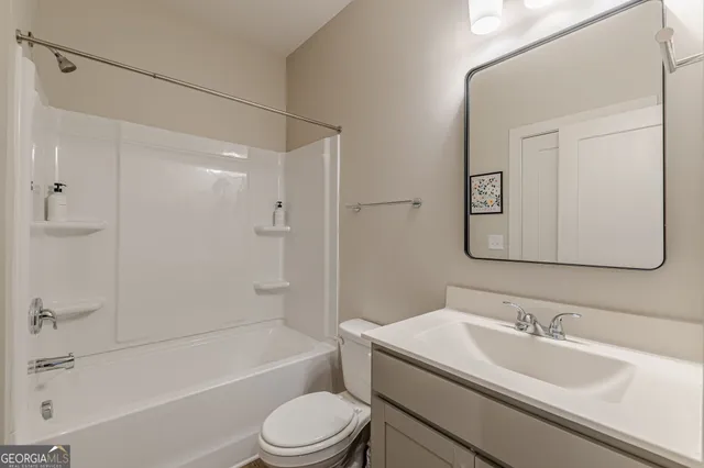 a view of a bathroom with tub and sink