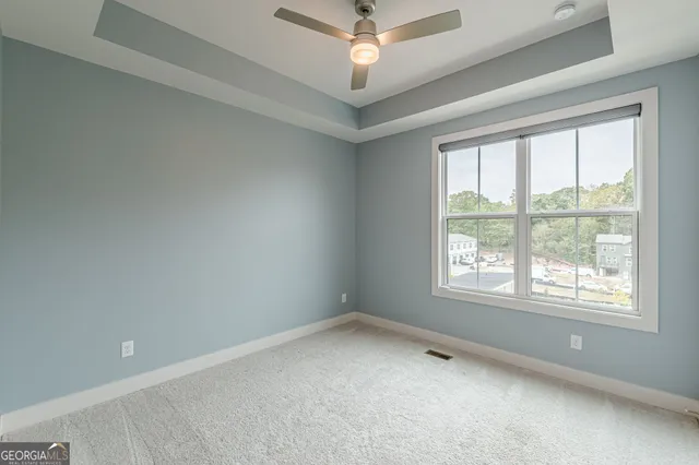 an empty room with a empty space and windows