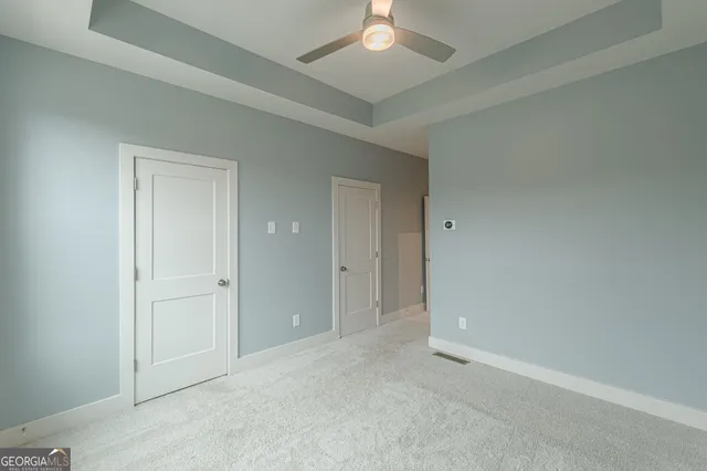 an empty room with a bathroom