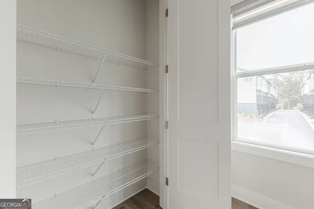 a view of storage and utility room with washer and dryer