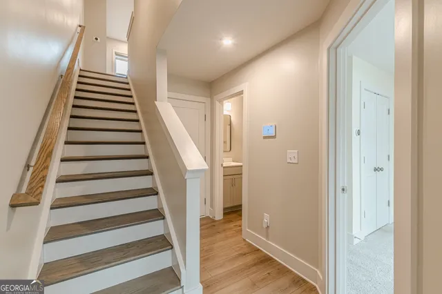 a view of entryway with wooden floor and stairs