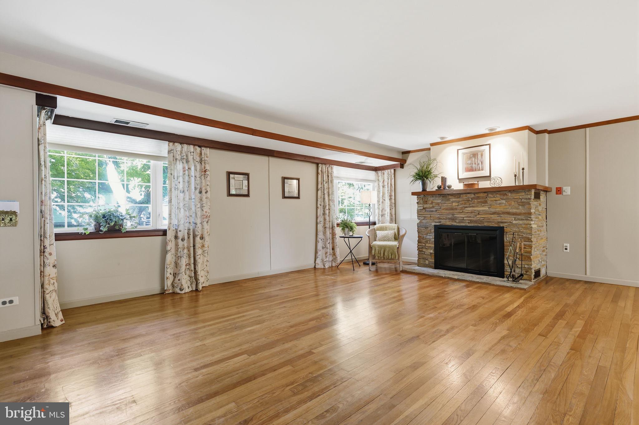 207 West Ferry Road Yardley, PA 19067 - Photo 11 of 50 a view of empty room with wooden floor and fireplace