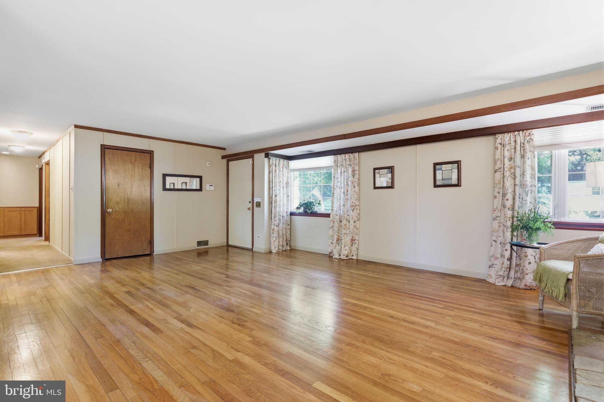 207 West Ferry Road Yardley, PA 19067 - Photo 12 of 50 a view of an empty room with wooden floor and a window