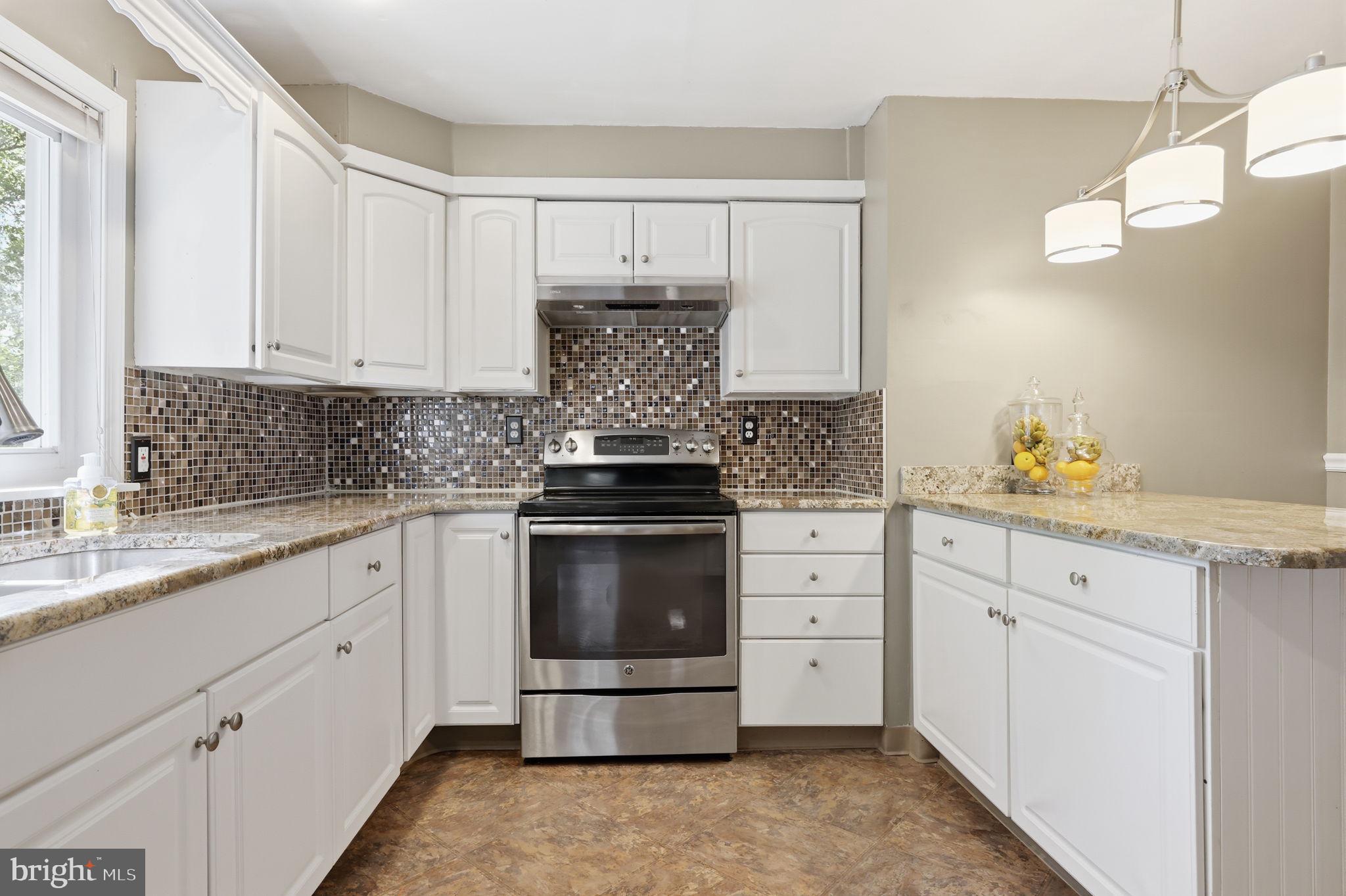 207 West Ferry Road Yardley, PA 19067 - Photo 16 of 50 a kitchen with granite countertop white cabinets white stainless steel appliances and a sink