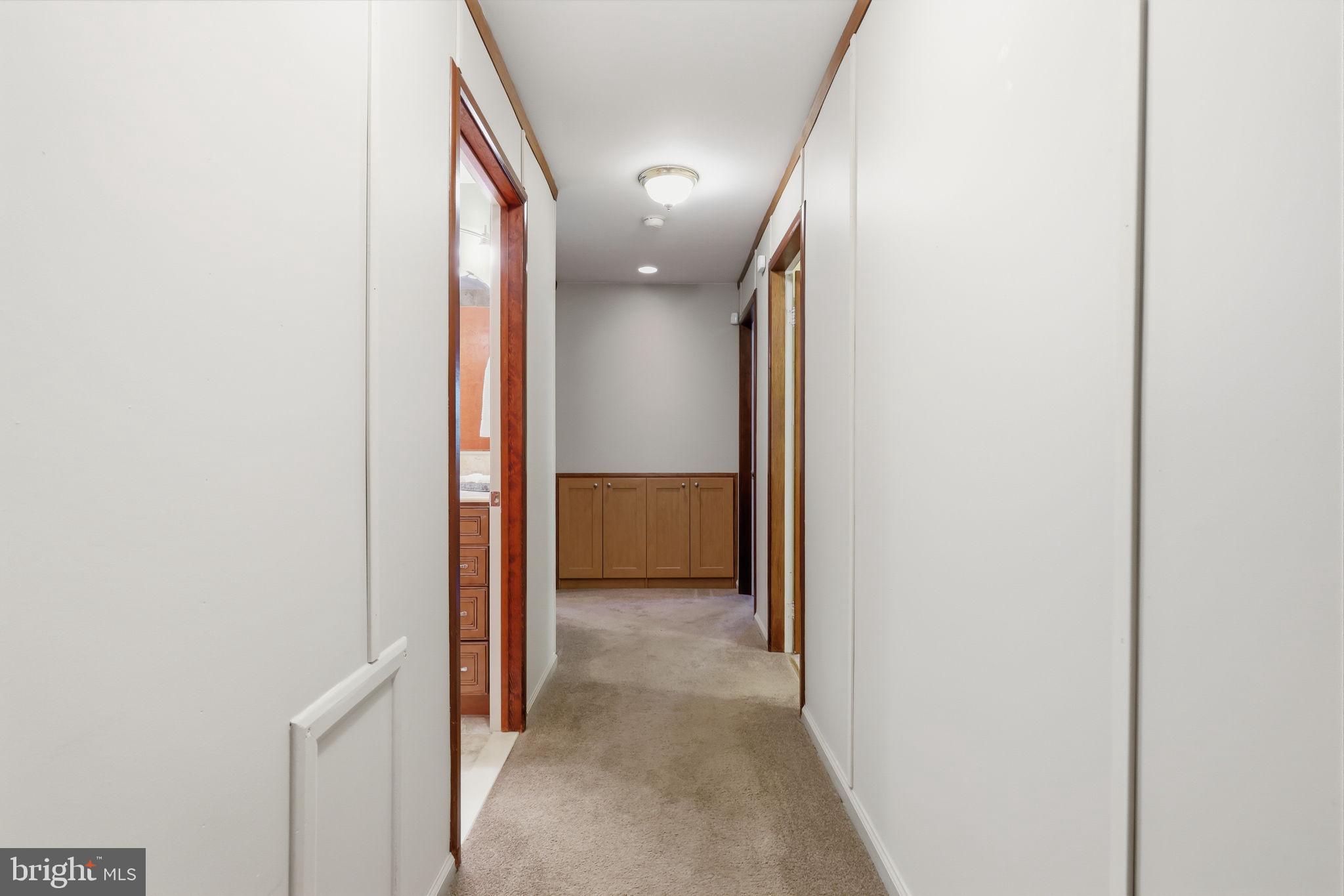 207 West Ferry Road Yardley, PA 19067 - Photo 19 of 50 a view of a hallway with wooden shelves