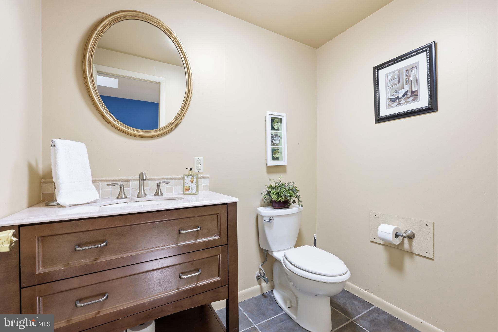 207 West Ferry Road Yardley, PA 19067 - Photo 36 of 50 a bathroom with a toilet a sink and a mirror
