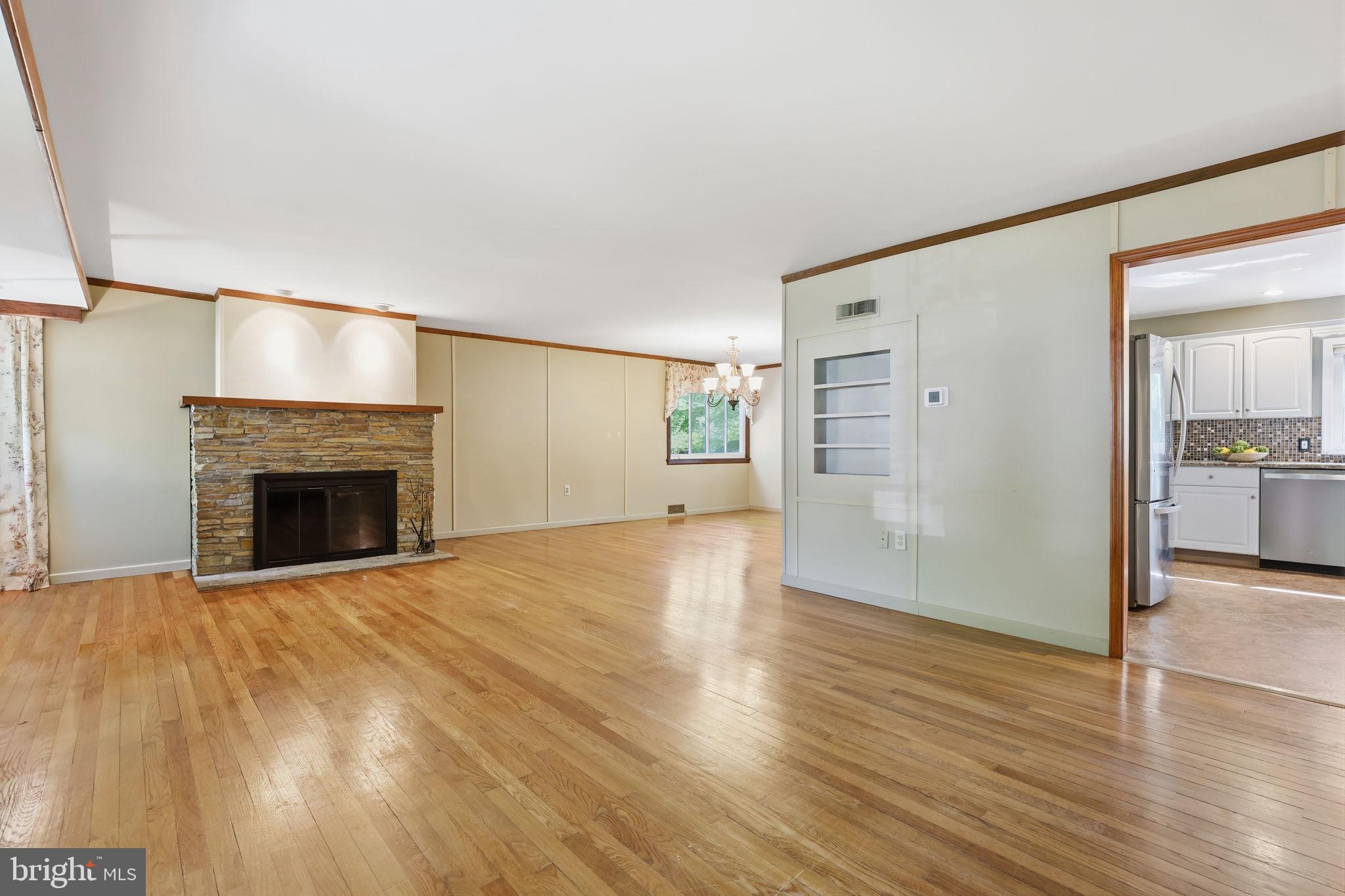 207 West Ferry Road Yardley, PA 19067 - Photo 4 of 50 a view of empty room with wooden floor and fireplace