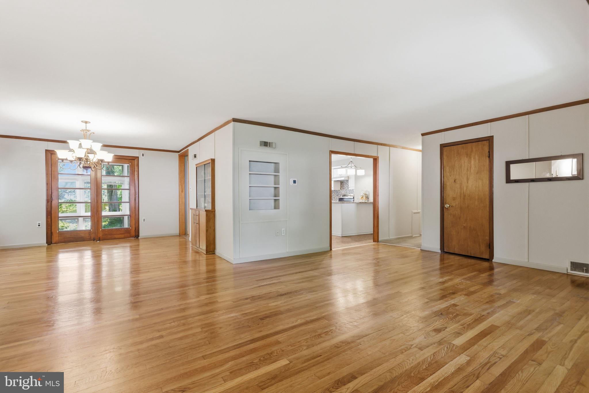 207 West Ferry Road Yardley, PA 19067 - Photo 6 of 50 an empty room with wooden floor and windows