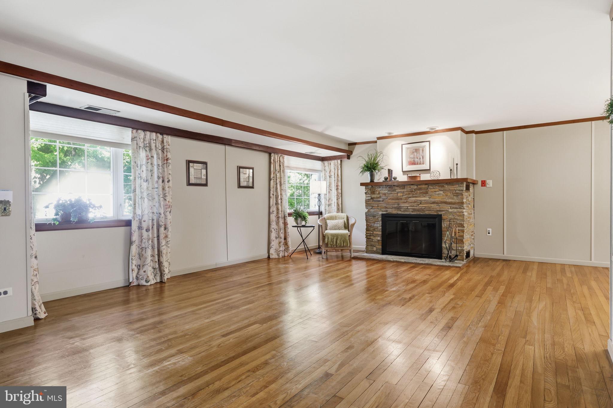 207 West Ferry Road Yardley, PA 19067 - Photo 9 of 50 a view of empty room with wooden floor and fireplace