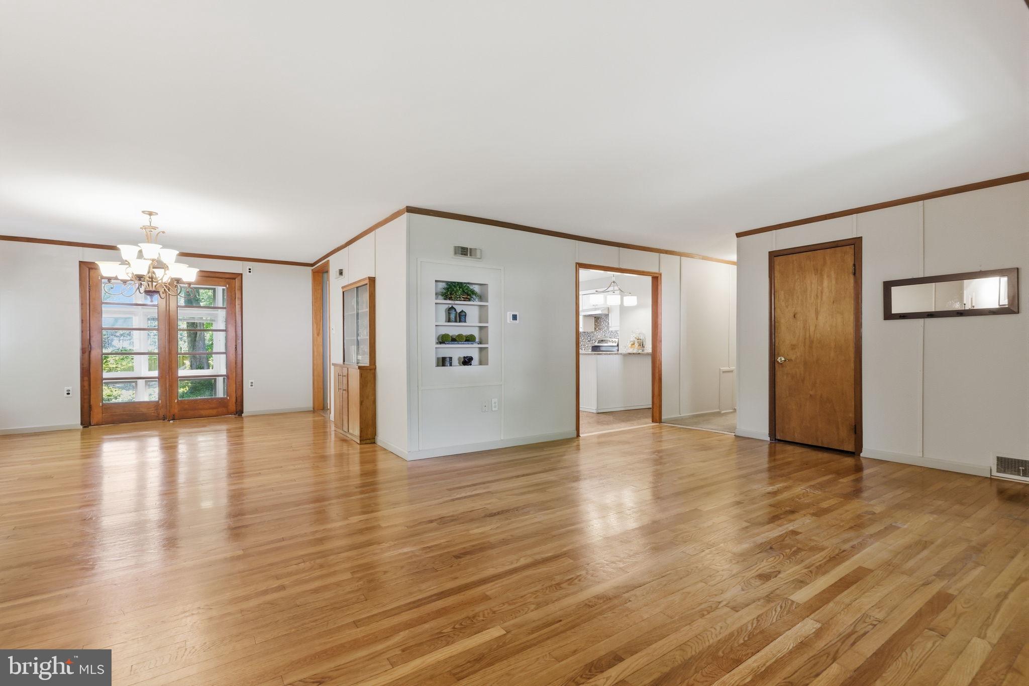 207 West Ferry Road Yardley, PA 19067 - Photo 10 of 50 an empty room with wooden floor and windows