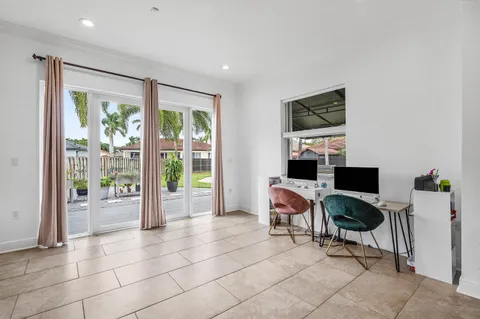 a living room with fireplace furniture and a flat screen tv