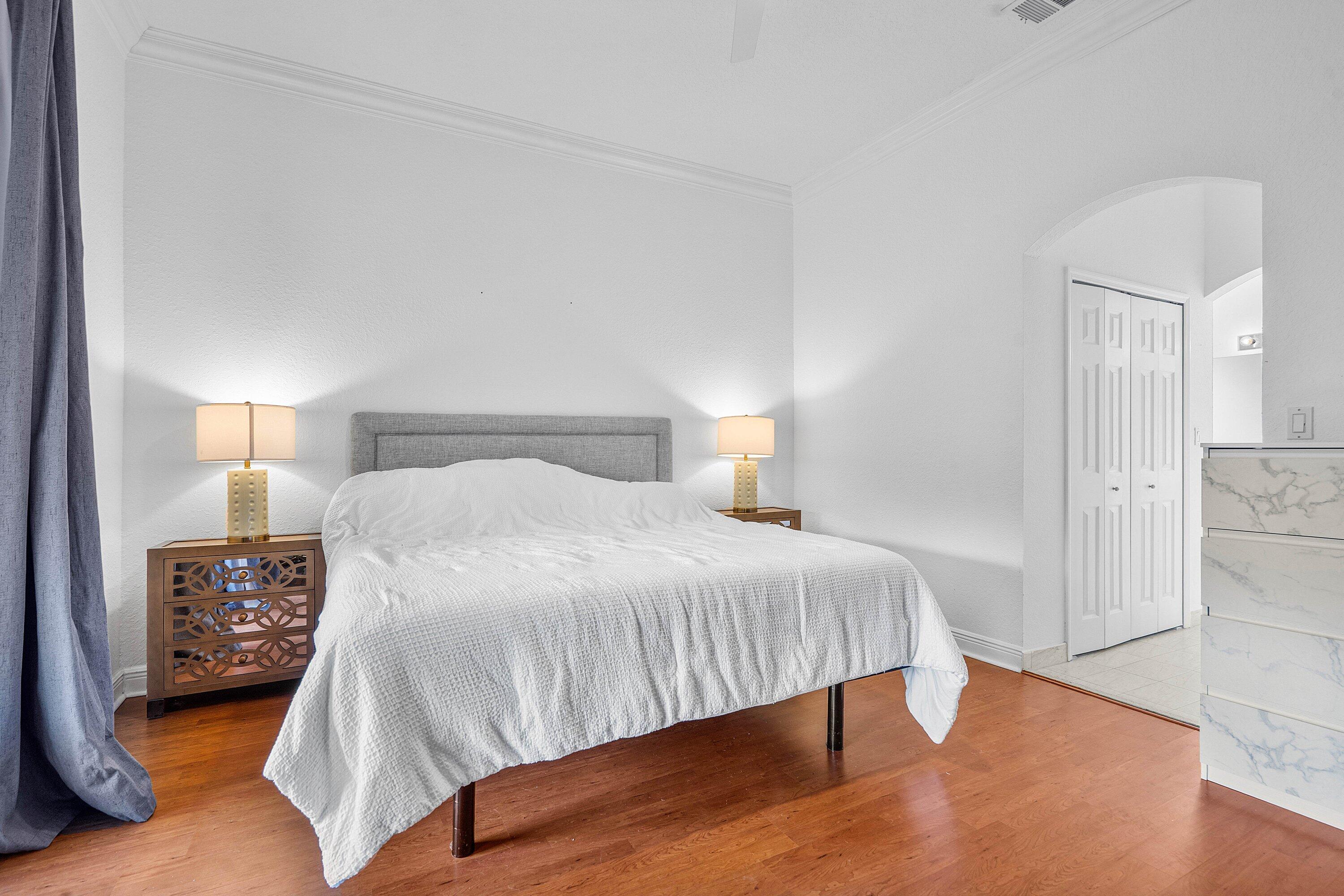 16852 Northwest 88th Path Miami Lakes, FL 33018 - Photo 22 of 34 a bedroom with a bed and a table