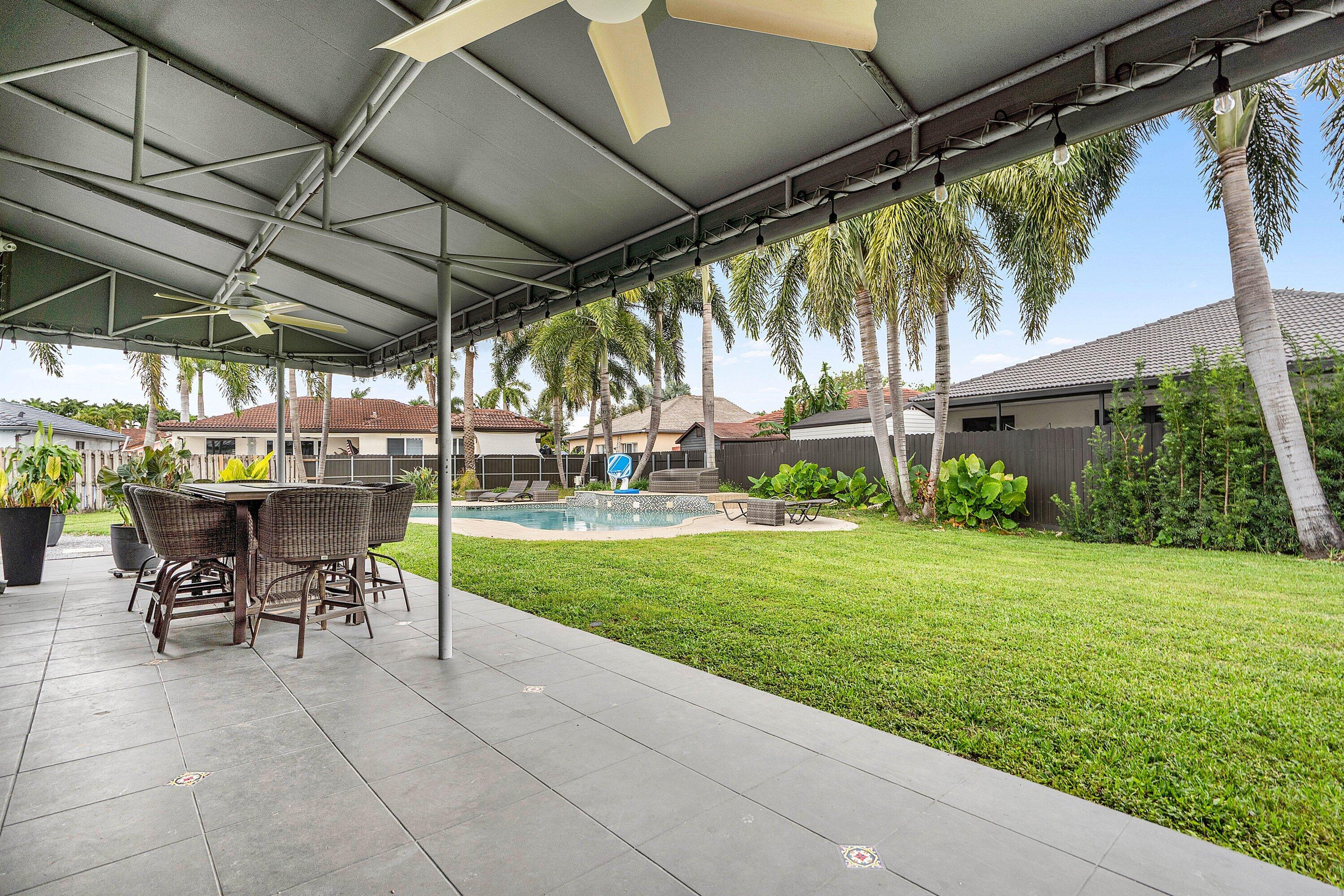 16852 Northwest 88th Path Miami Lakes, FL 33018 - Photo 29 of 34 a view of yard with patio