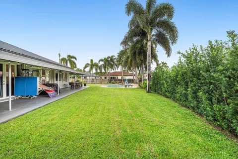 a view of swimming pool with seating area