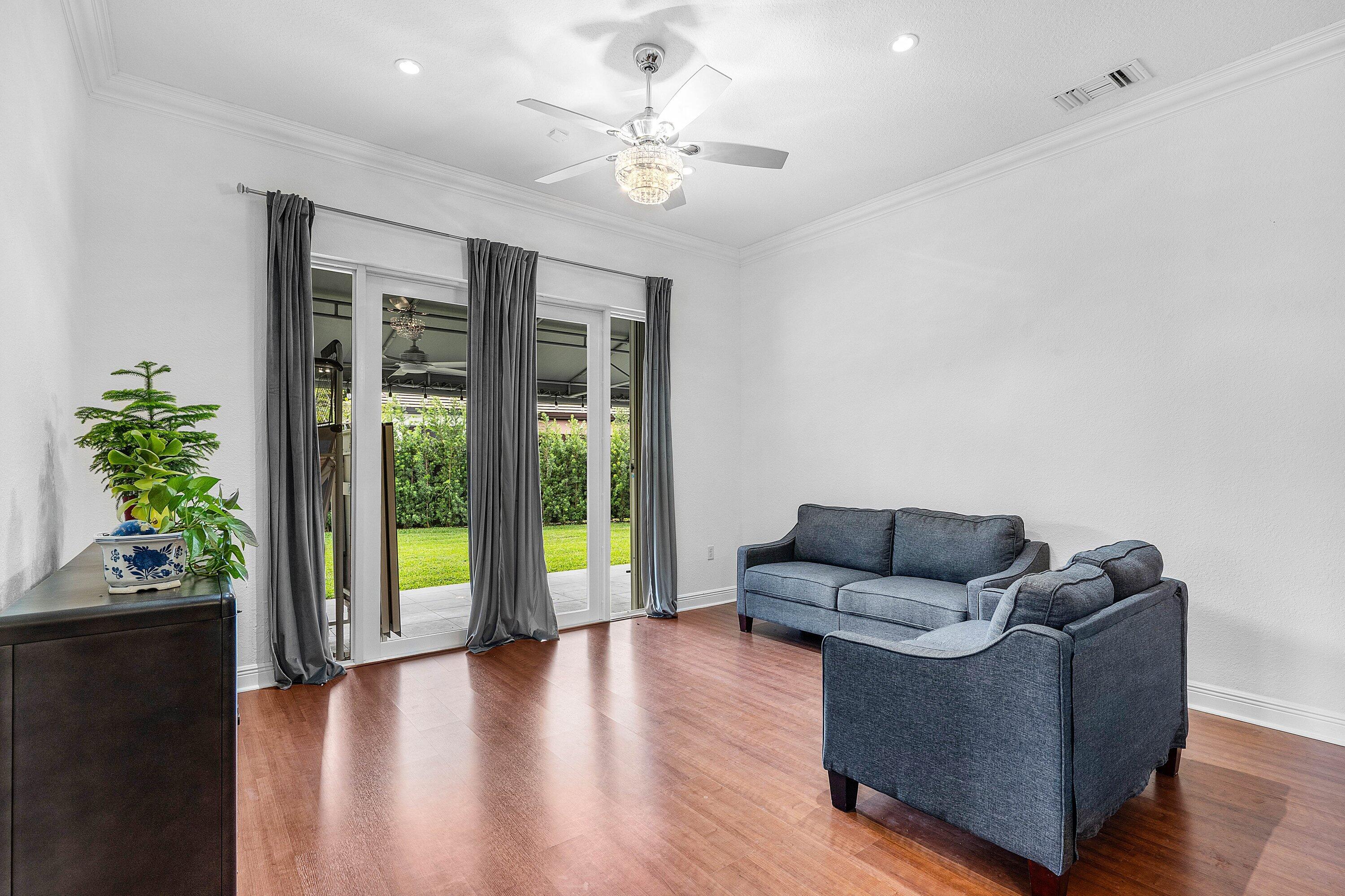 16852 Northwest 88th Path Miami Lakes, FL 33018 - Photo 5 of 34 a living room with furniture and a large window