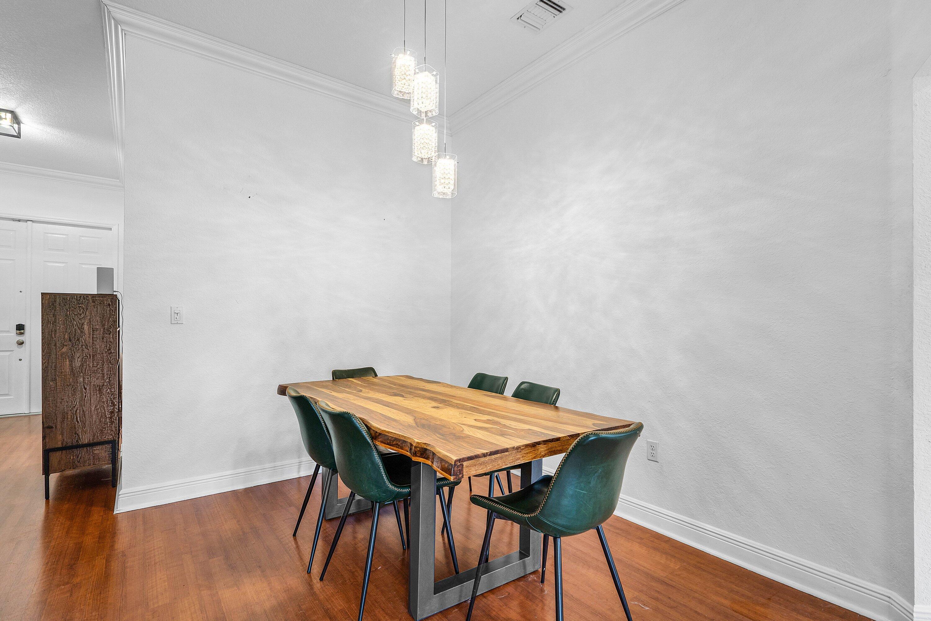 16852 Northwest 88th Path Miami Lakes, FL 33018 - Photo 7 of 34 a view of a dining room with furniture and wooden floor