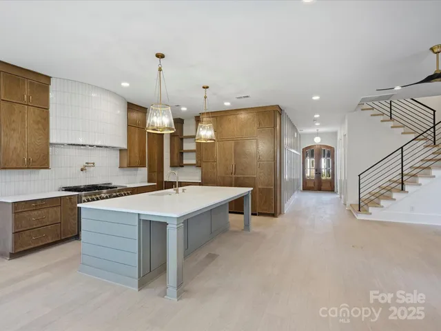 a kitchen with a stove and a refrigerator