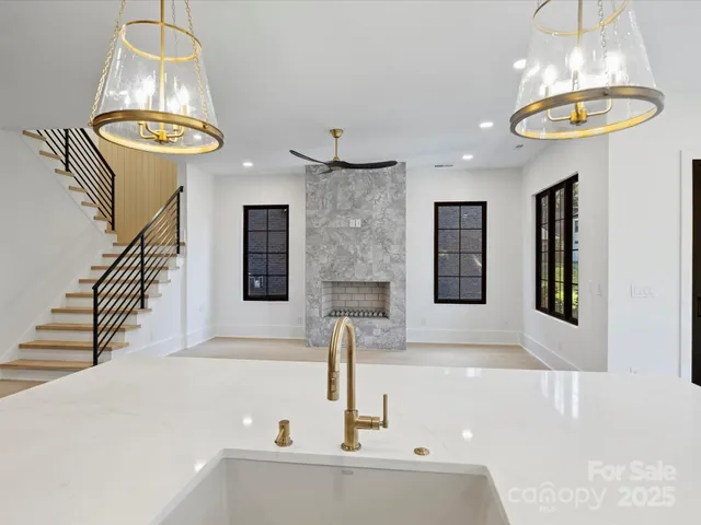 a bathroom with a sink and a chandelier