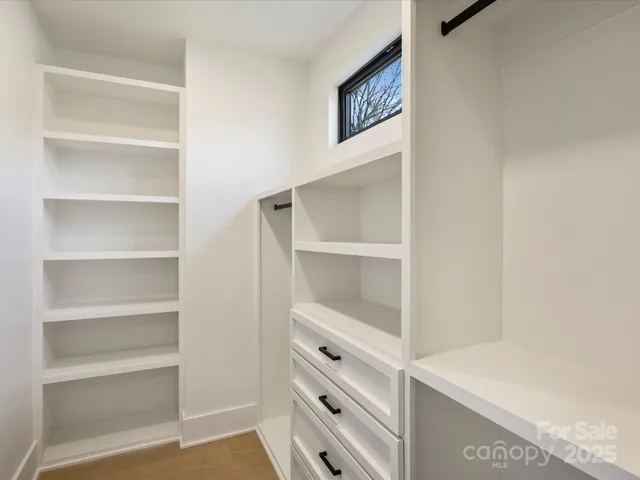 a view of an empty walk in closet