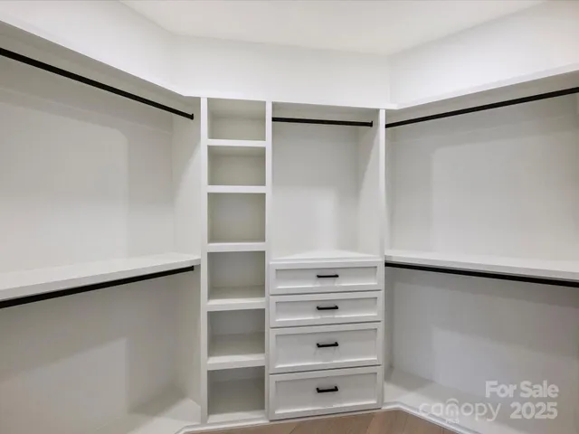 a view of an empty walk in closet