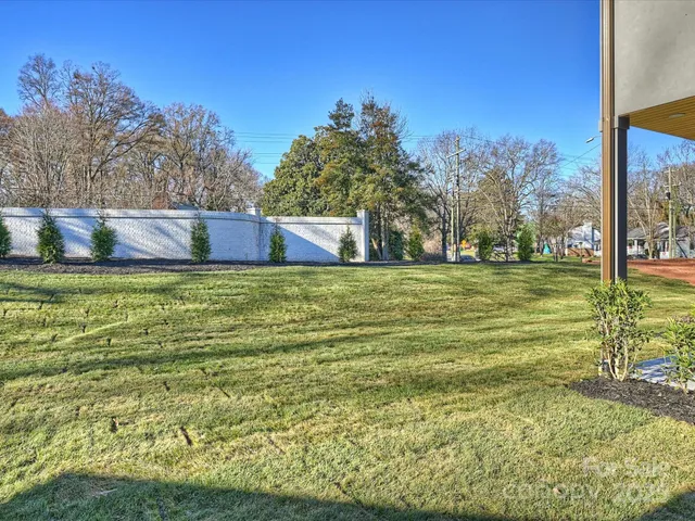 a view of a pool with a yard