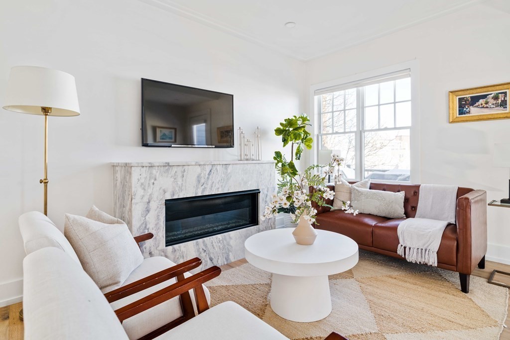 33 Summit Avenue, Unit 33 Brookline, MA 02446 - Photo 13 of 28 a living room with furniture and a fireplace
