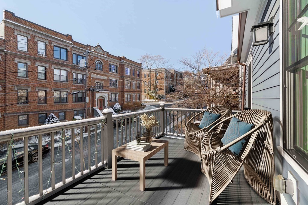 33 Summit Avenue, Unit 33 Brookline, MA 02446 - Photo 15 of 28 a view of a balcony with two chairs and wooden floor