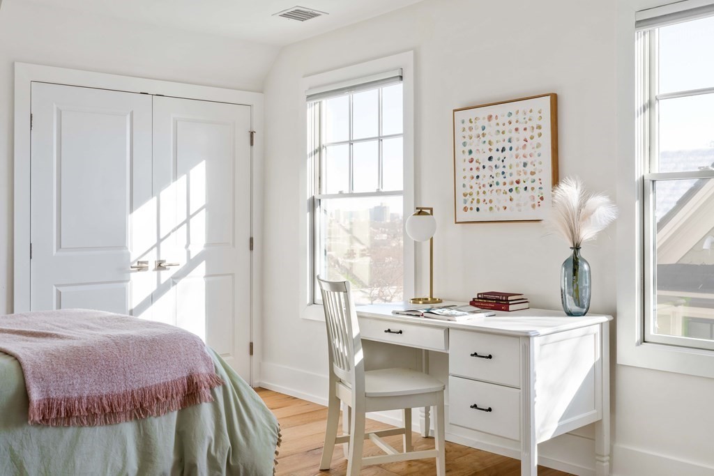 33 Summit Avenue, Unit 33 Brookline, MA 02446 - Photo 20 of 28 a bedroom with a bed and a window