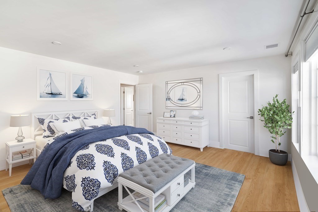 33 Summit Avenue, Unit 33 Brookline, MA 02446 - Photo 23 of 28 a bedroom with a bed and a couch