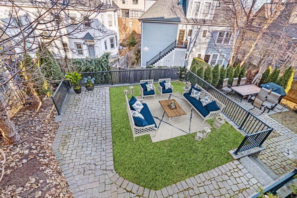 33 Summit Avenue, Unit 33 Brookline, MA 02446 - Photo 27 of 28 a view of a chairs and table in backyard