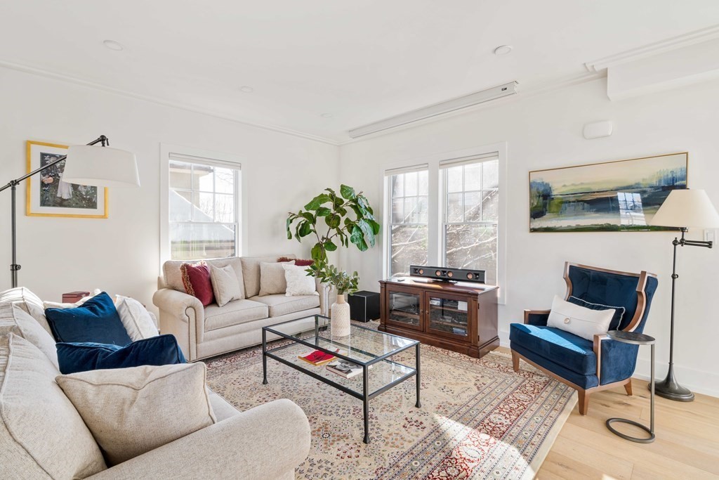 33 Summit Avenue, Unit 33 Brookline, MA 02446 - Photo 5 of 28 a living room with furniture and a fireplace