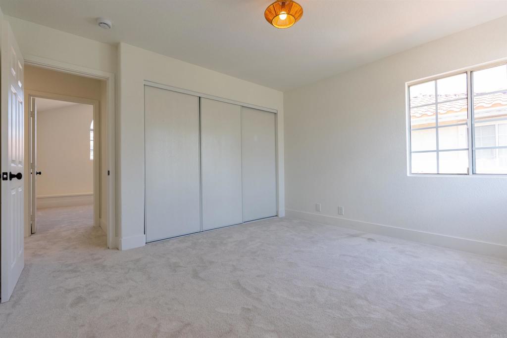 841 Friendly Circle El Cajon, CA 92021 - Photo 17 of 20 an empty room with windows and closet