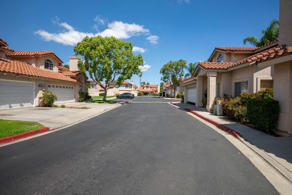 841 Friendly Circle El Cajon, CA 92021 - Photo 3 of 20 a house with a yard and a large parking space