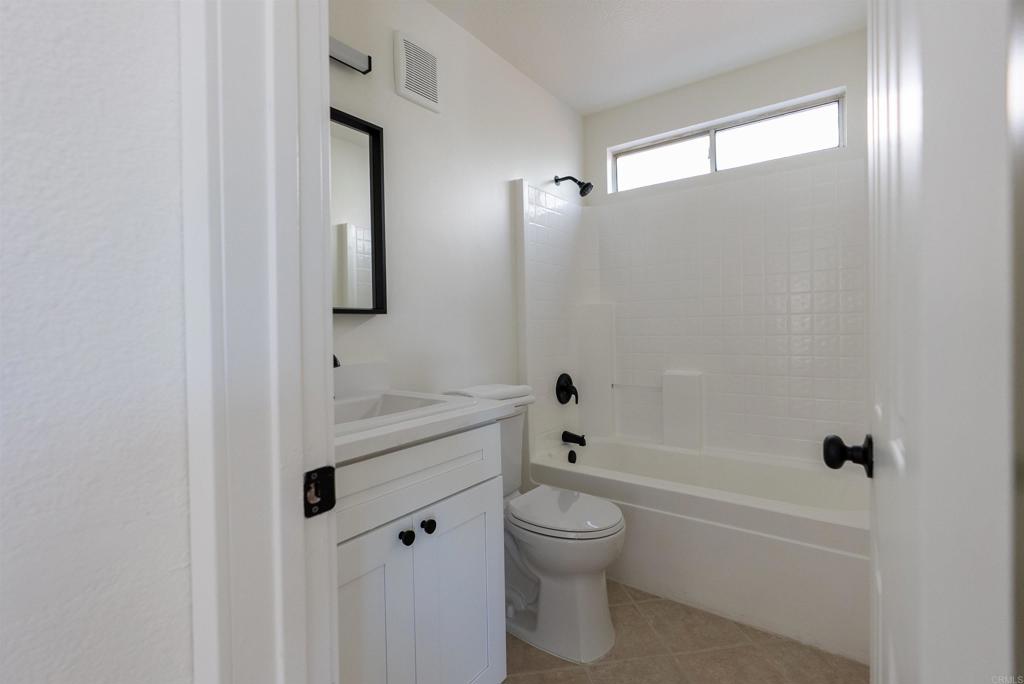 841 Friendly Circle El Cajon, CA 92021 - Photo 10 of 20 a bathroom with a sink a toilet and shower