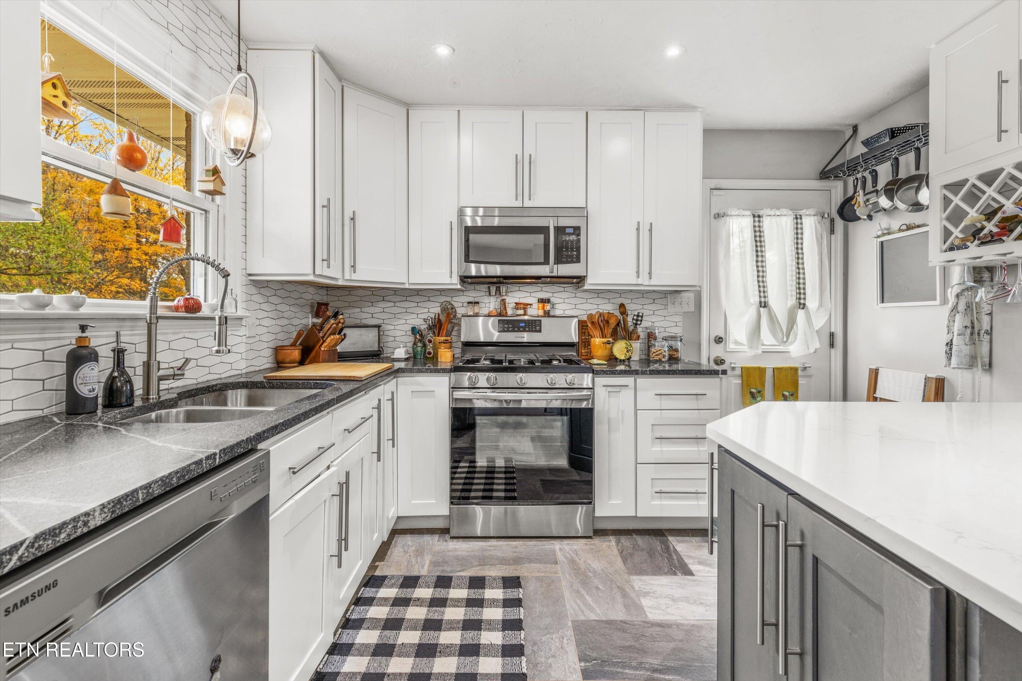 7919 North Forest Road Knoxville, TN 37909 - Photo 12 of 29 a kitchen with a sink stove and refrigerator