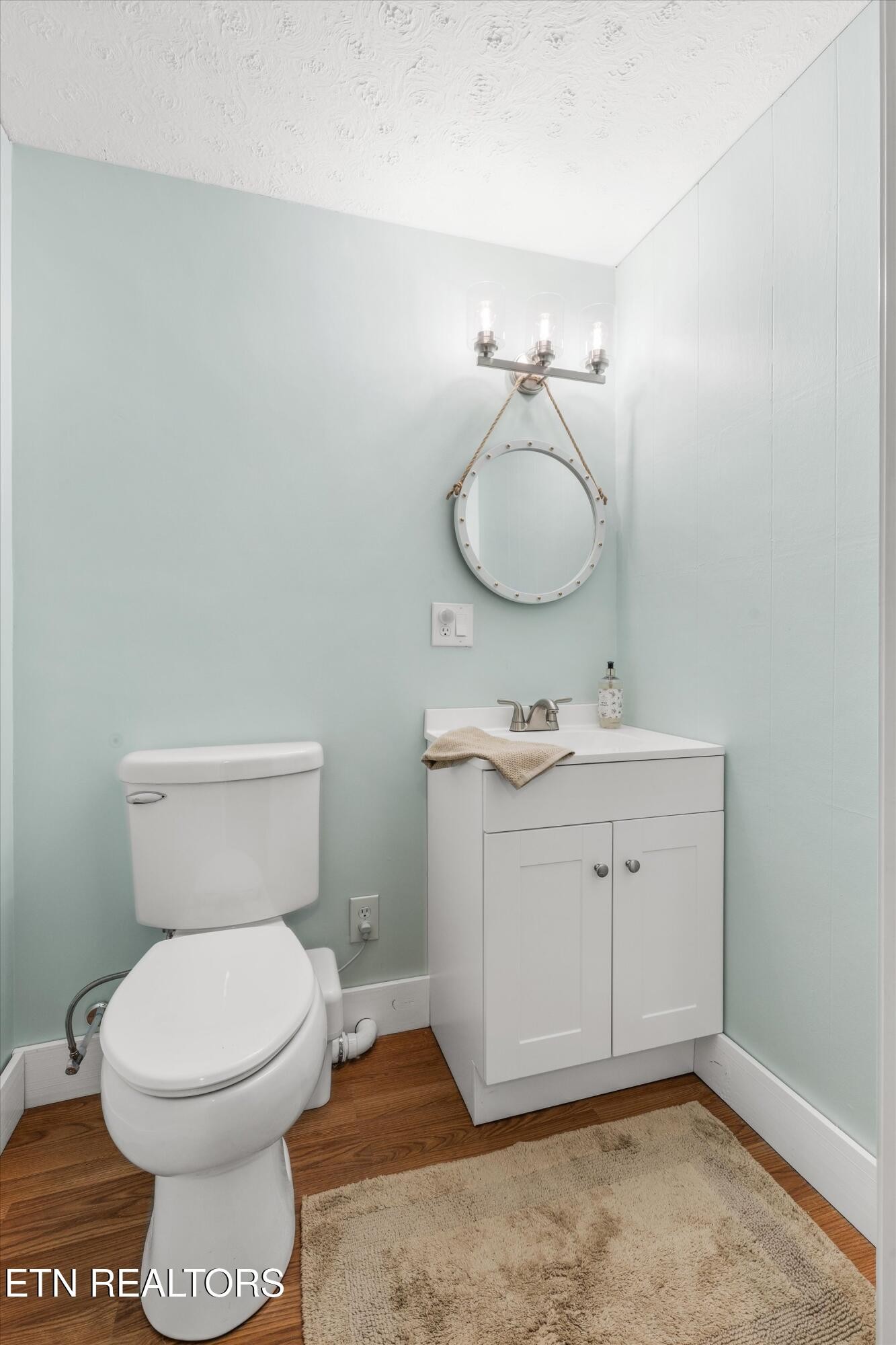 7919 North Forest Road Knoxville, TN 37909 - Photo 20 of 29 a bathroom with a toilet sink a mirror and vanity