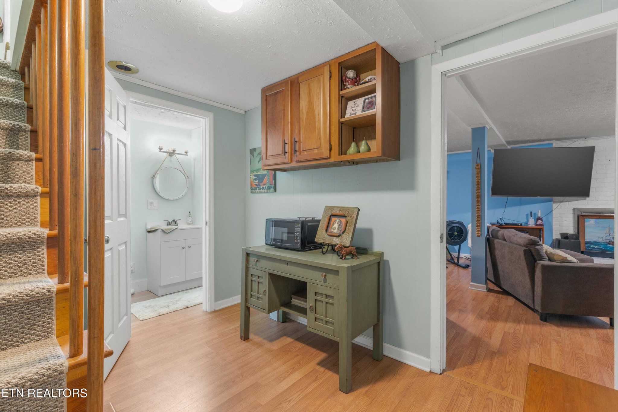 7919 North Forest Road Knoxville, TN 37909 - Photo 21 of 29 a view of a workspace with furniture and a flat screen tv