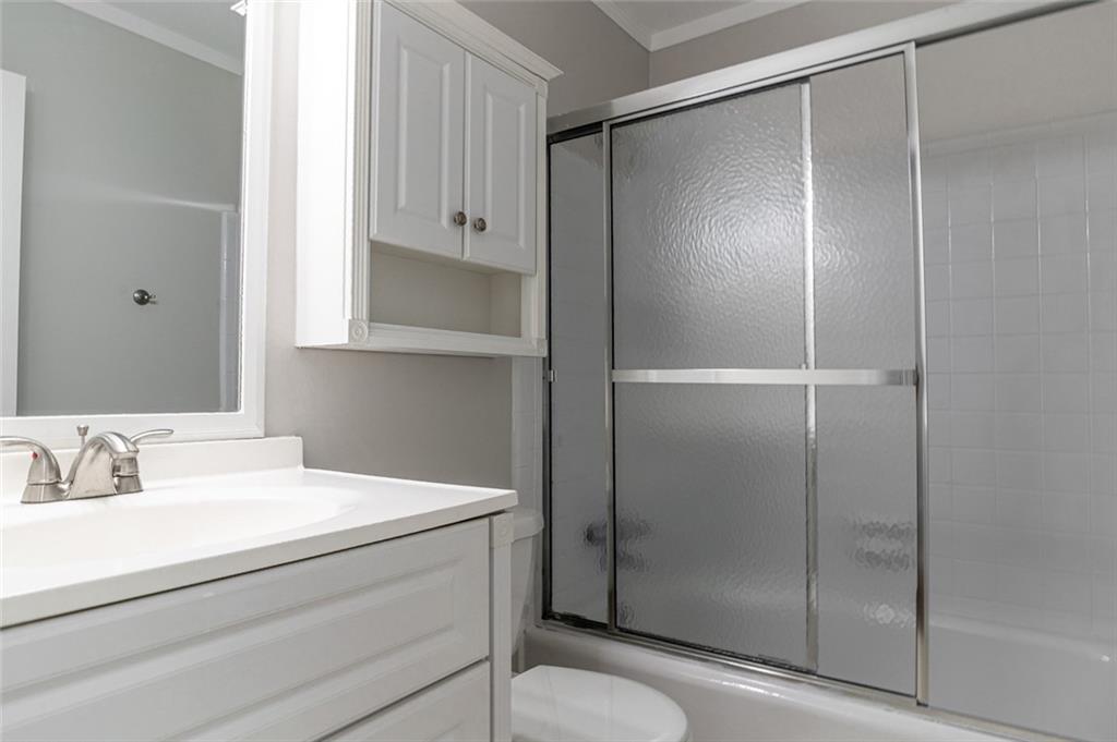 3599 Lower Roswell Road Marietta, GA 30068 - Photo 24 of 64 a bathroom with a shower and a sink