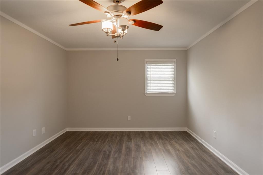 3599 Lower Roswell Road Marietta, GA 30068 - Photo 28 of 64 wooden floor in an empty room with a window